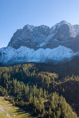 Fototapeta premium Aerial Mountain Landscape with Autumn Forest and Clear Blue Sky, Großer Ahornboden, Austria