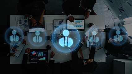 A diverse group of professionals collaborates in a modern office, engaging with data visualizations on digital devices while fostering effective communication and innovation. Raster