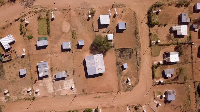 Overhead poor houses in dry landscape