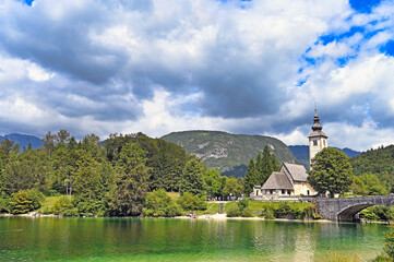 Old stone bridge and church in Ribcev Laz,Bohinj Lake landscape, Slovenia