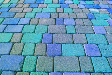 Colored concrete flooring block assembled on a substrate of sand - type of flooring permeable to...