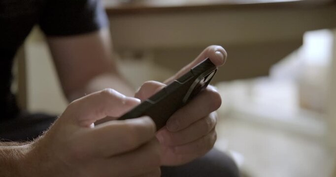 Man playing mobile phone close-up. High quality 4k footage