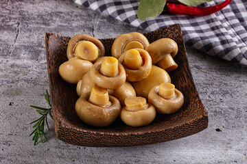 Fototapeta premium Marinated pickled champignon in the bowl