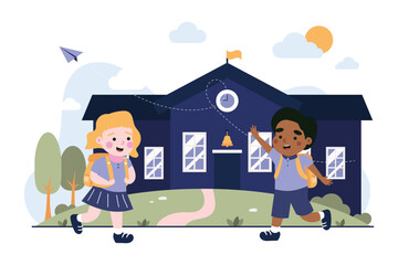 Happy children with backpacks walking towards a school building kids education