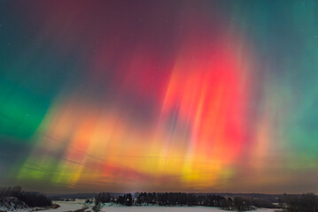 Naklejka premium Aurora borealis, The Northern lights at Kuldiga, Latvia.