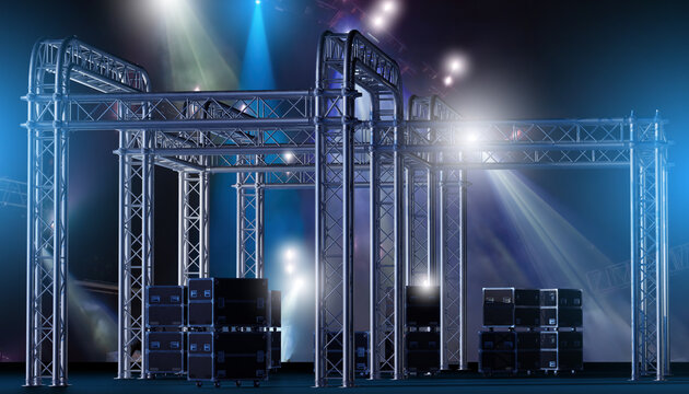 Event production, concert stage setup. Aluminum truss structures with lighting effects and equipment cases prepared for live show production, stage construction, and technical event support.