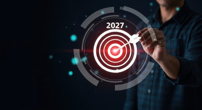 Businessman pointing to a target with a glowing red bullseye and 2027 written on it in a futuristic setting with blue lights - Powered by Adobe