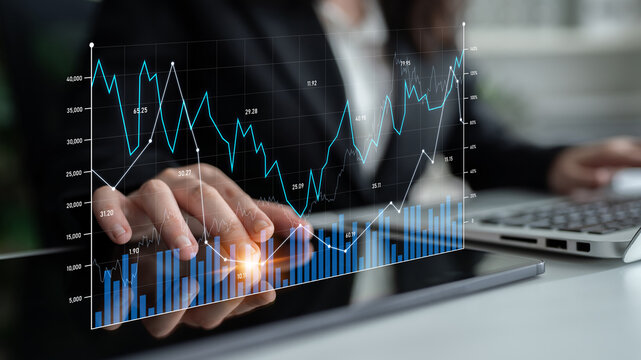 Business professional engages in stock market analysis using a digital tablet, surrounded by modern office elements and detailed financial charts, emphasizing investment strategies. Scalp
