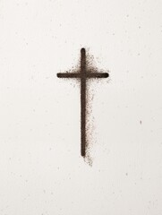 Cross made of ash on white background representing Ash Wednesday
