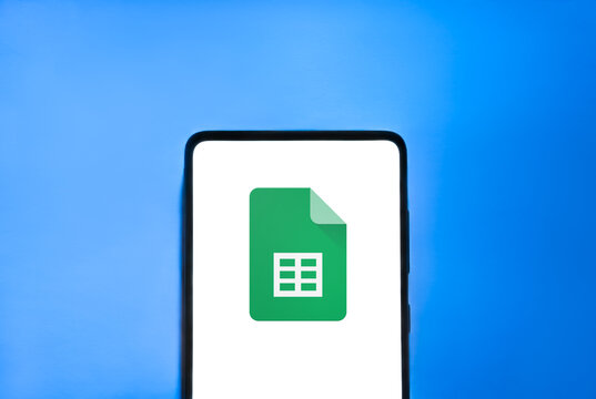 Google Sheets logo on smartphone screen, blue background. Link&ouml;ping, &Ouml;sterg&ouml;tland, Sweden 01-25-2026.