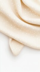 Polka dot fabric with soft folds isolated on white background.