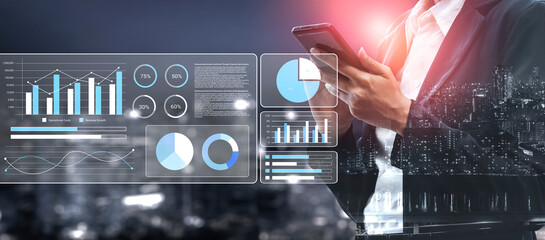 A business professional stands against a city skyline, engaged in data analysis on a smartphone, surrounded by digital graphs and vibrant visuals, symbolizing modern business. Gantry