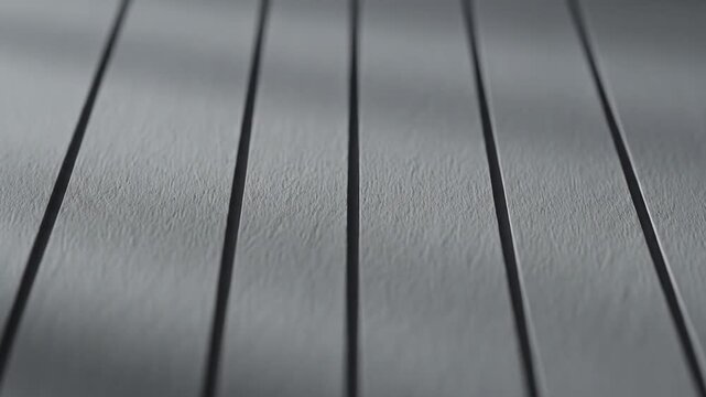 Closeup of a textured surface with parallel lines creating a subtle pattern and depth.