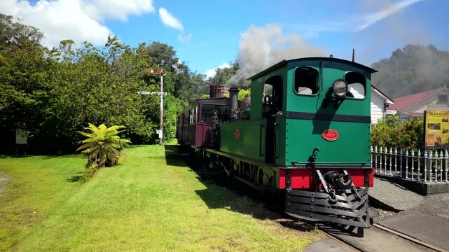Approaching Vintage Steam Train At Small Station