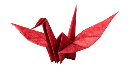 Red paper origami crane with clean folds displayed on a white background at a crafts event