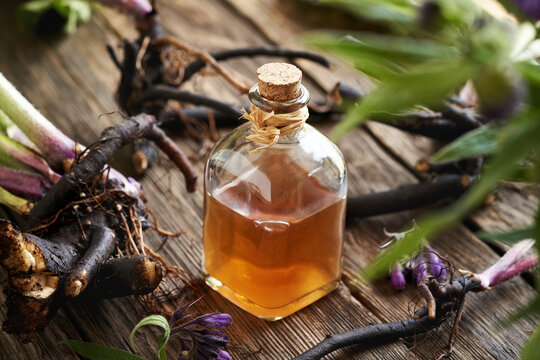Comfrey root tincture in a glass bottle