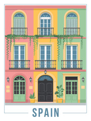 Obraz premium Colorful Spanish Architecture Building Facade with Balconies and Plants