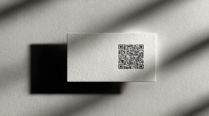Modern business card design with QR code and minimalist shadow effect