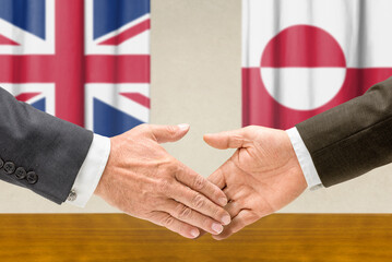 Symbolic cooperation concept &ndash; Great Britain and Greenland handshake