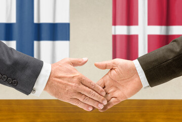 Symbolic cooperation concept &ndash; Finland and Denmark handshake