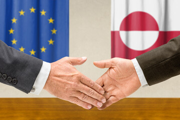 Symbolic cooperation concept &ndash; European Union and Greenland handshake