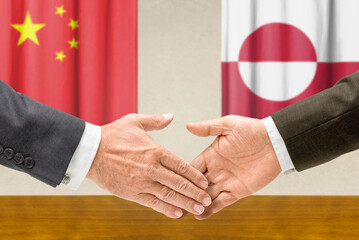 Symbolic cooperation concept &ndash; China and Greenland handshake