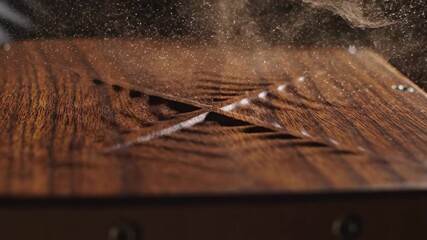 Woodworking with Precision: An Artisan craft intricate details on a wooden surface, fine sawdust dances in the air, a close-up of skillful craftsmanship.