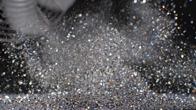 Soft beams of light illuminate fine dust particles swirling in the air as a fan gently stirs them up, creating an enchanting spectacle. The room glows with tiny sparkles, captivating the senses.