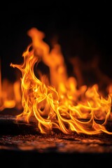 Fototapeta premium Isolated fire blaze with vivid color gradient against a deep black backdrop
