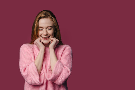 Joyful Woman Smiling, Content Young Female Dressed In Pink Enjoying Peaceful Moments In Warm Ambiance