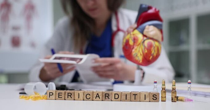 Word Pericarditis of wooden cubes with vials and heart anatomical model in hospital. Woman doctor researches patient scans to assess disease