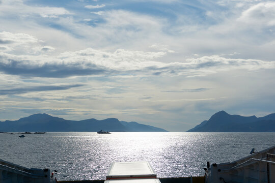 Scenic View of Karls&oslash;yfjord from E39 Ferry Deck in Norway with Sun Reflections