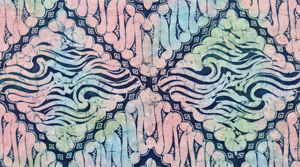 Traditional Indonesian Batik fabric texture background with abstract pastel motifs on dark blue cloth