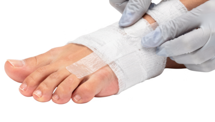 Medical professionals hands applying sterile white gauze and transparent adhesive tape around a patients toe post nail treatment set against a clean white background.