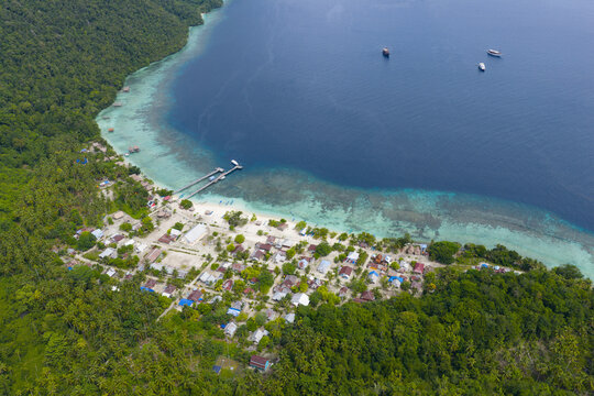 On the island of Mansuar, the small, quaint village of Sauwandarek looks out upon the Dampier Strait in Raja Ampat, Indonesia. 