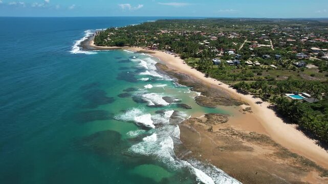 Panoramic aerial image of Tr&ecirc;s Coqueiros beach, southern coast of Bahia, Mara&uacute; Peninsula, Barra Grande, beach with coconut trees, large stretch of white sand, blue water, paradisiac