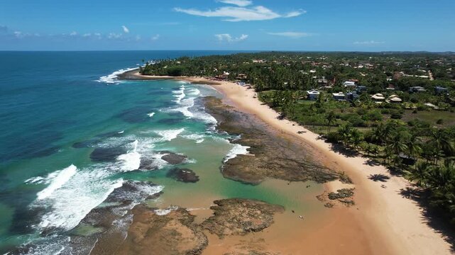 Panoramic aerial image of Tr&ecirc;s Coqueiros beach, southern coast of Bahia, Mara&uacute; Peninsula, Barra Grande, beach with coconut trees, large stretch of white sand, blue water, paradisiac