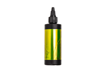 Black applicator bottle with a metallic yellow-green label, isolated on a white back