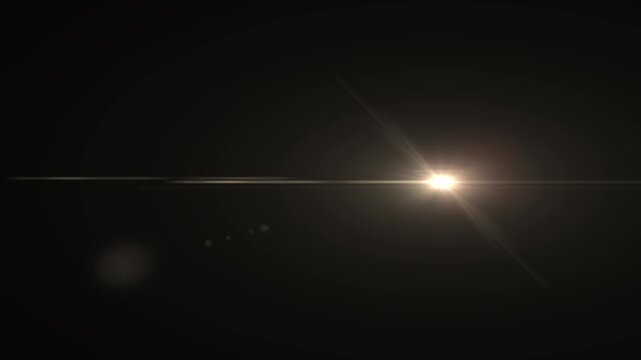 Dynamic golden lens flare with a horizontal light ray and scattered light orbs creating a warm, energetic glow on a deep black backdrop for creative overlays.