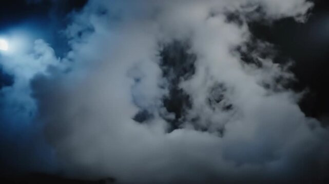 Abstract white cloud formation against dark background
