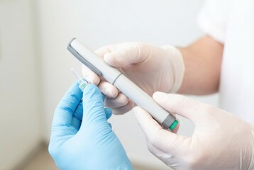 Medical professional guides patient in using an insulin pen during a health consultation in a clinic setting