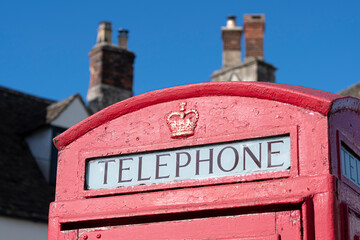 Typical old red Telephone cabin in urban England, United Kingdom
