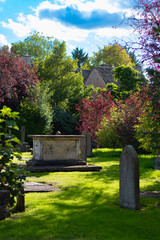 Urban cemetery on a green garden on an autumn scene in the Cotswolds