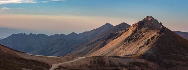 This Colorado mountain panorama features a lone Jeep parked at Engineer Pass along the Alpine Loop....