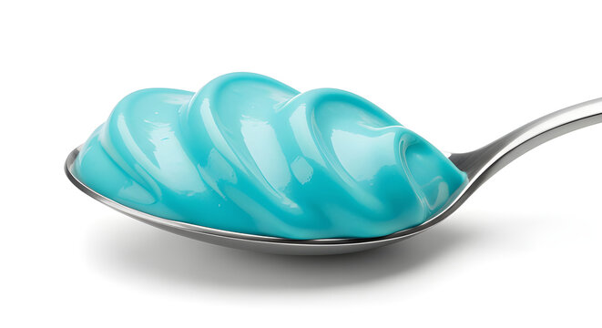 Blue spirulina cream on metal spoon isolated on white background, vibrant superfood color and modern food trend.