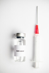 A Isolated medical vial and syringe with a label reading Anti-Vaxer