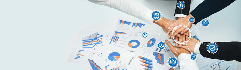 Analyst team putting hand together after successful plan of business strategy and marketing....