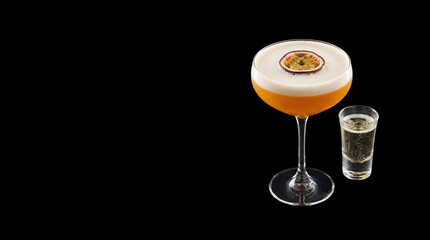 pornstar martini cocktail with prosecco and copy space on a black background
