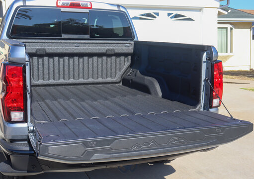 View of the back of a truck with a spray-on bed liner.