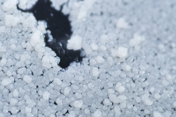 Form of white dots on bottle surface on expired cooking palm oil